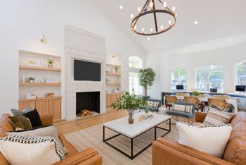 Newly renovated modern clubhouse with social seating, large flat screen tv & coffee bar