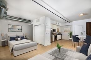 Los Angeles apartment for rent - a bedroom with a bed and a living room with a kitchen  at The LC, Los Angeles