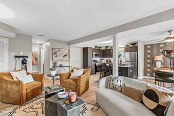 Palatine apartment for rent - A living room with a grey couch and a coffee table.