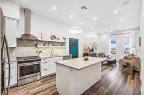 Las Vegas apartment for rent - a kitchen with a large center island next to a living room with a couch