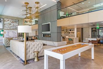 San Diego apartment for rent - a living room filled with furniture and a table with a board game