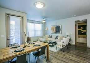 Las Vegas apartment for rent - A dining room with a wooden table and chairs.