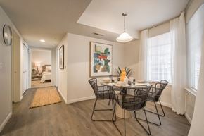 Riverton apartment for rent - A dining room with a table set for two and a painting on the wall.