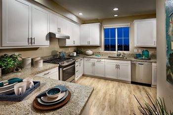 Modern shaker-style cabinetry with stainless appliances