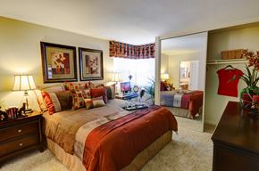 La Mesa apartment for rent - A bedroom with a large bed and a mirrored closet