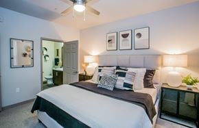 Las Vegas apartment for rent - A bedroom with a large bed and a ceiling fan.