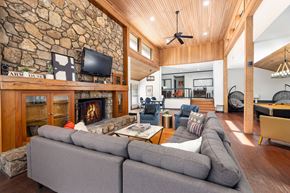Chapel Hill apartment for rent - the living room has a large stone fireplace and a large couch