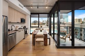 Nashville apartment for rent - a kitchen and dining room with a view of the city