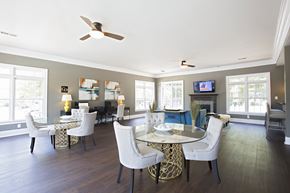 Fairburn apartment for rent - Resident clubhouse with tables and chairs at Peachtree Landing Fairburn, GA apartment rentals.
