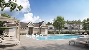 Rolesville apartment for rent - A pool surrounded by lounge chairs and trees.