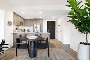 Washington apartment for rent - A modern dining room with a round table and chairs.