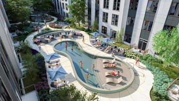 Madison apartment for rent - A large outdoor pool surrounded by trees and people sunbathing.