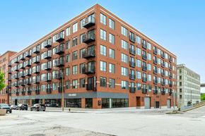 1014 Spurce St apartment for rent - A large red brick building with many windows and balconies.