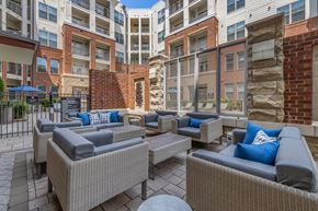 Raleigh apartment for rent - an outdoor lounge area at the bradley braddock road station apartments