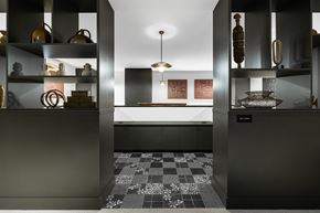 Pittsburgh apartment for rent - A modern kitchen with black cabinets and a checkered floor.