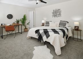 Vancouver apartment for rent - a bedroom with a bed and desk in a 555 waverly unit