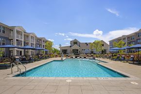 Raleigh apartment for rent - A large swimming pool in the middle of a resort area.