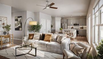 Knightdale apartment for rent - A modern living room with a grey sofa and a coffee table.