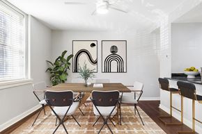 Philadelphia apartment for rent - A dining room with a table set for two and a plant in the corner.