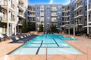 Brookhaven apartment for rent - an apartment building with a swimming pool in front of it
