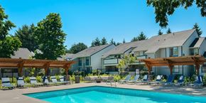 Vancouver apartment for rent - Pool deck with lounge chairs and pergolas at Brookside112 Apartments, Vancouver, Washington