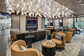 Arlington apartment for rent - A modern lounge area with a large screen TV and comfortable seating.