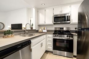Los Angeles apartment for rent - Modern kitchen with stainless steel appliances and white cabinets at Cahuenga Heights, Los Angeles, CA