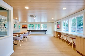 Renovated modern clubhouse with social seating, shuffle board & coffee bar