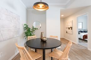 Denver apartment for rent - A dining room with a round table and chairs.