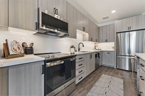 Scottsdale apartment for rent - A modern kitchen with a stainless steel refrigerator and oven.