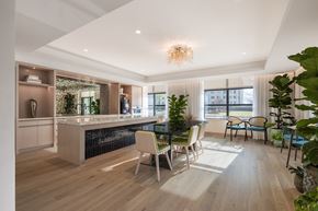 Washington apartment for rent - A modern kitchen with a dining area and a living room.