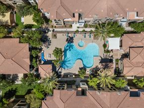 Avondale apartment for rent - An aerial view of a swimming pool surrounded by houses and trees.
