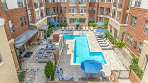 Raleigh apartment for rent - an aerial view of the resort style pool at the bradley braddock road station apartments
