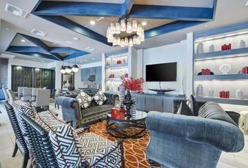 La Mesa apartment for rent - a living room with blue and white furniture and a tv