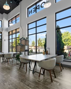 Charlotte apartment for rent - A modern dining room with a long table and chairs.