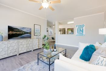 Wide plank wood style flooring throughout living, dining and kitchen areas*