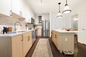 Philadelphia apartment for rent - a kitchen with wooden cabinets and stainless steel appliances