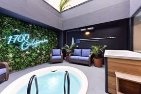 San Francisco apartment for rent - A modern indoor space with a pool and a green wall. at 1700 California Street, San Francisco, CA 94109