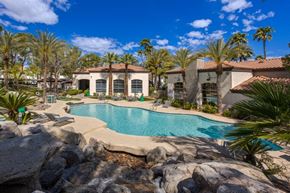 Las Vegas apartment for rent - An apartment building with a pool in front of it.