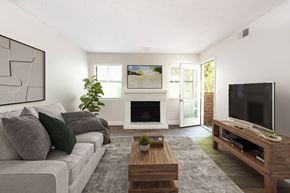 Westminster apartment for rent - A living room with a grey couch, a coffee table, and a fireplace.