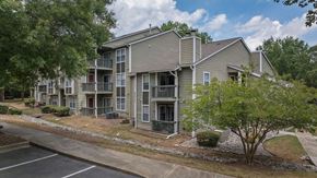 Chapel Hill apartment for rent - exterior view of an apartment building with sidewalks and trees