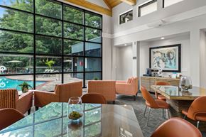 Lake Oswego apartment for rent - A modern dining room with a glass table and chairs.