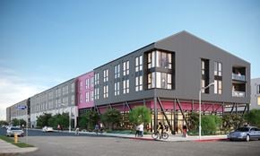 Los Angeles apartment for rent - A modern building with a grey facade and pink accents is surrounded by a street scene with cars, bicycles, and pedestrians.