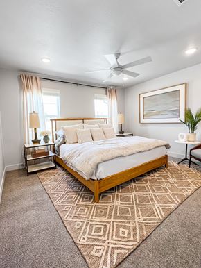 Lehi townhouse for rent - a bedroom with a bed and a ceiling fan
