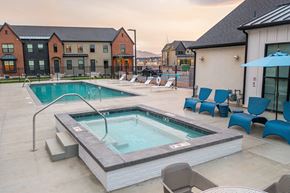 Lehi townhouse for rent - our apartments have a pool and lounge area with chairs