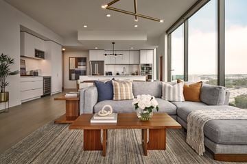 Austin apartment for rent - A modern living room with a grey sofa and a coffee table.