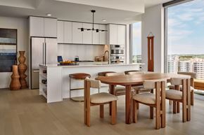 Austin apartment for rent - A modern kitchen with a dining table and chairs.