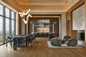 Austin apartment for rent - A modern dining room with a long table and chairs.