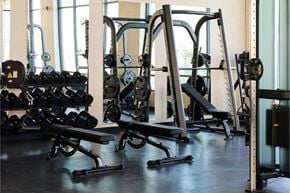 Vineyard apartment for rent - A gym with a variety of equipment including dumbbells, weight plates, and weight machines.