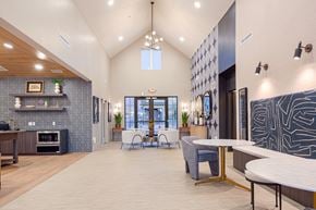 Murray townhouse for rent - A residential lounge area with tables and chairs at The Wheeler townhomes near Salt Lake City, UT.